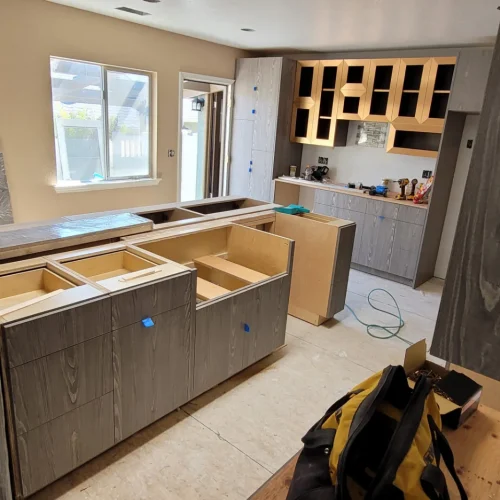 Kitchen renovation process 02 Ongoing kitchen renovation featuring newly built cabinets and countertops in progress.